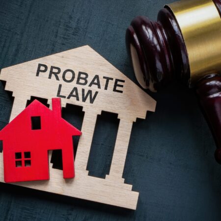 Probate law concept. Gavel and a house model.