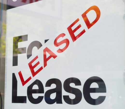 For lease and leased sign on display outside a building