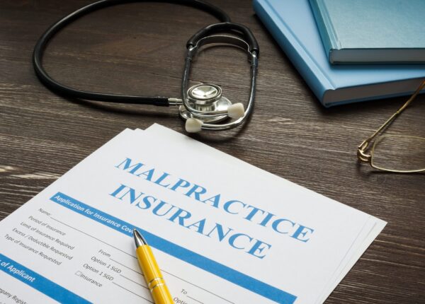 Medical malpractice insurance application with stethoscope.